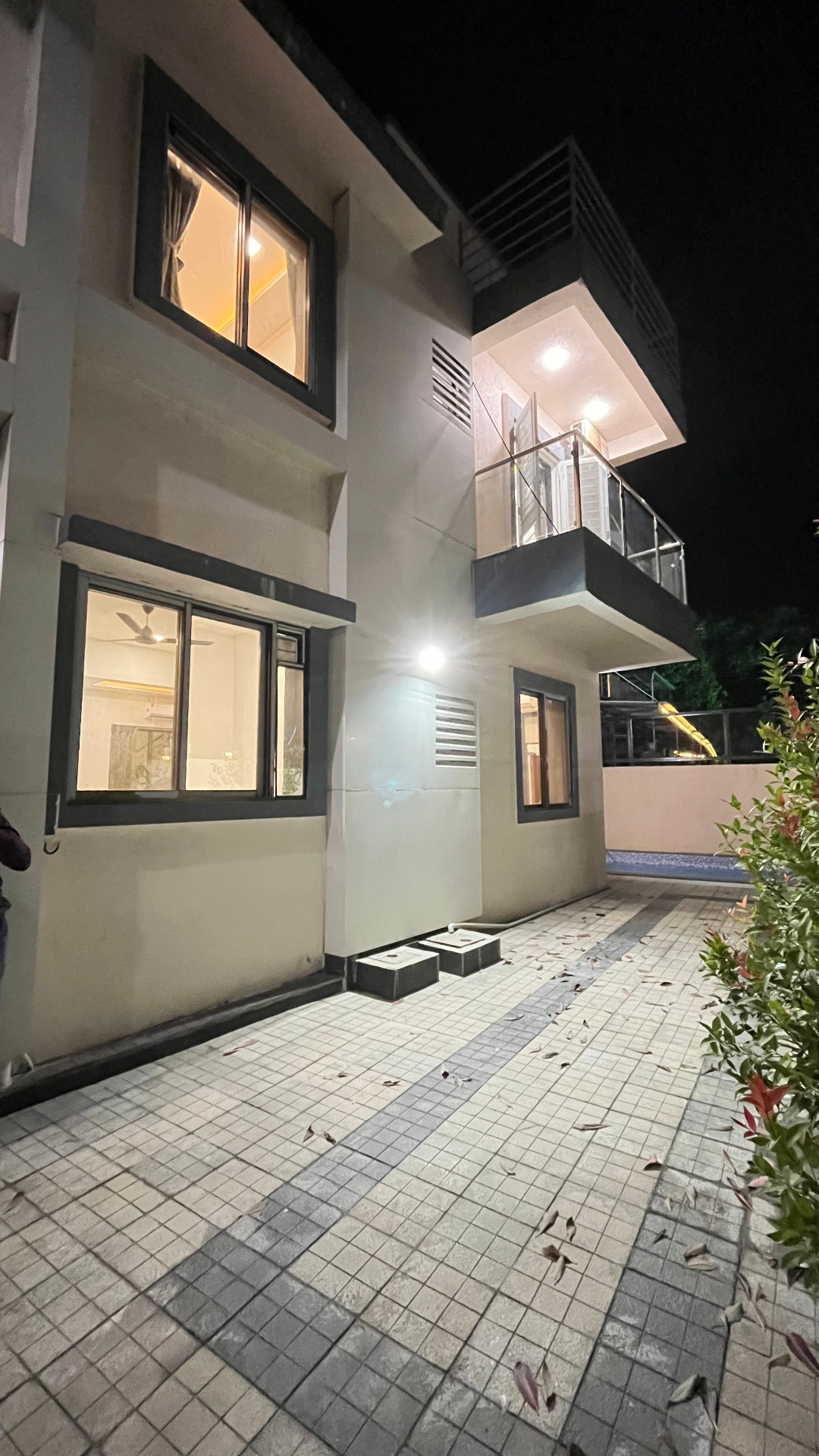 Saanjh villa illuminated side view at evening