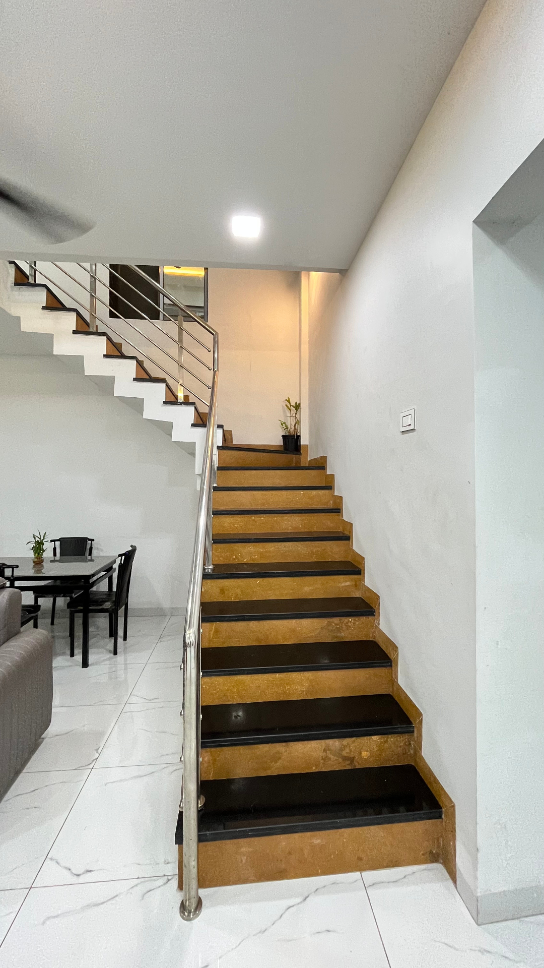 Marble staircase leading to bedrooms at Saanjh villa